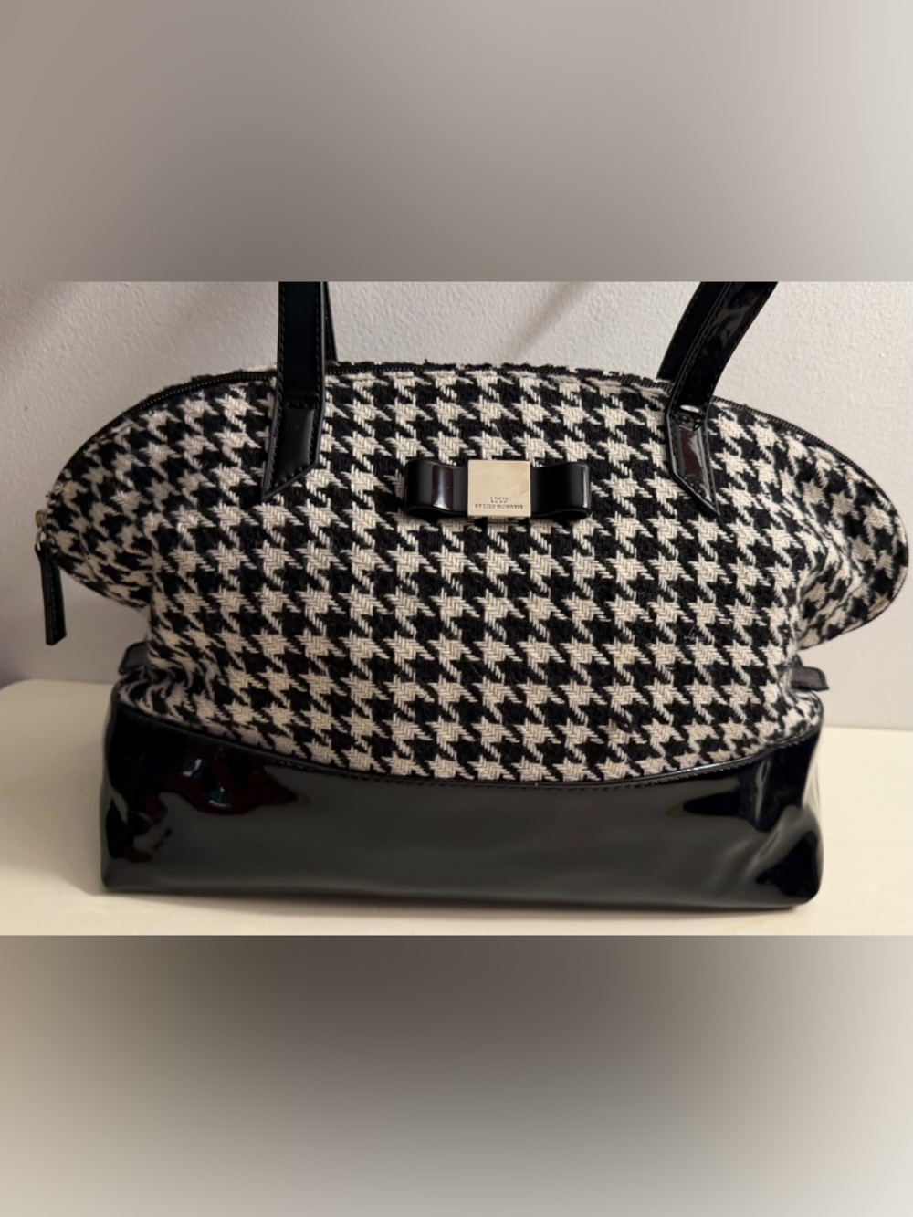 Lulu by Lulu Guinness woven houndstooth pattern with black vinyl patent trim